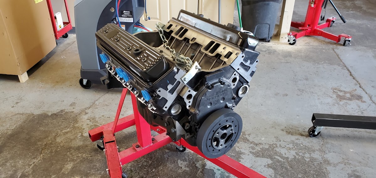 A rebuilt engine block on the stand at Platinum Auto Repair